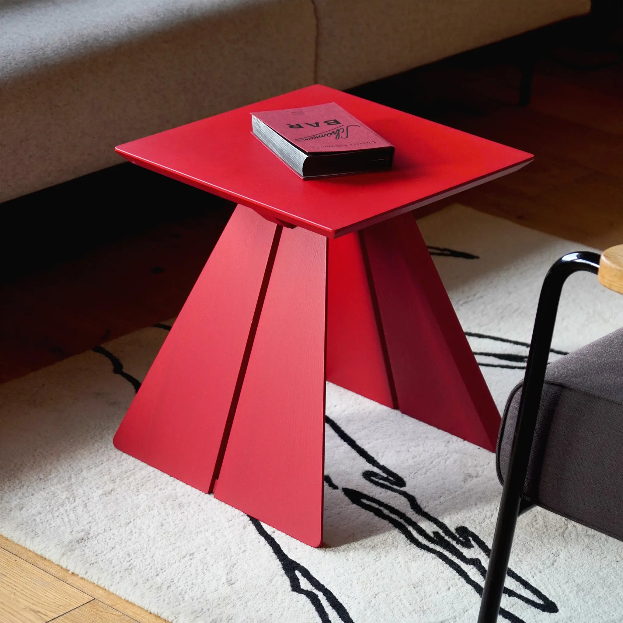 HIRONIMUS ORIGAMI side table lacquered ash ruby red – next to sofa timeless design